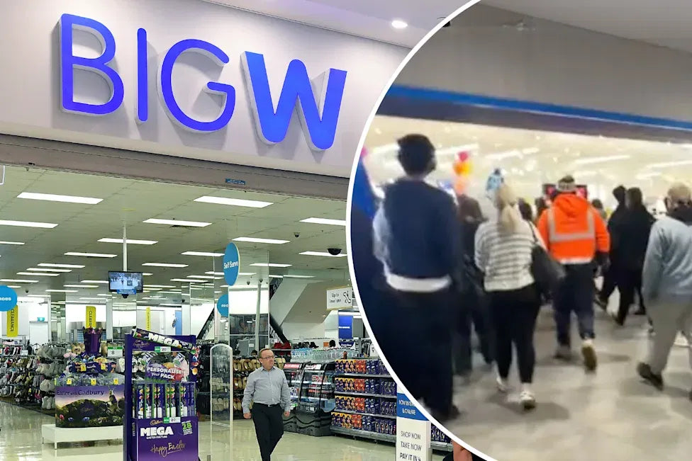 Shoppers rushing into a Big W store on release morning